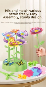 Detail of child hand assembling colorful DIY garden building blocks on green base