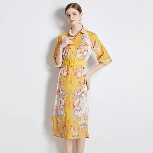 Elegant yellow floral shirt dress with long midi cut, lapel collar, and matching belt