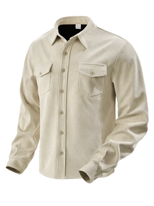 Detail of beige corduroy texture and buttoned chest pocket on a long sleeve shirt