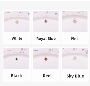 Detailed view of sunflower charm pendants in six colors with gold plating and crystals