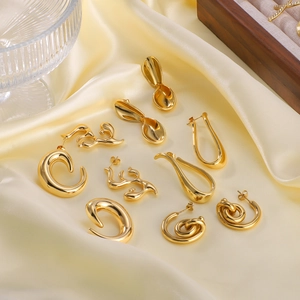 French vintage style 18K gold plated titanium steel earrings set on silk backdrop
