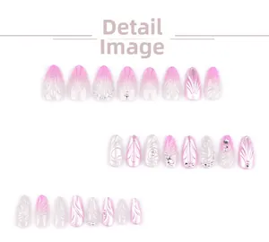 Macro detail of 3D pink gradient press-on nails with shell texture and pearls