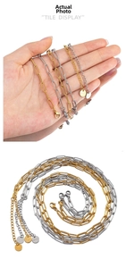 Detail of stainless steel rectangular link chains in gold and silver with lobster clasp