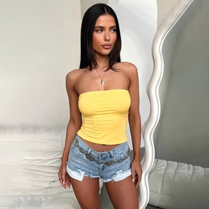 Close-up of bright yellow slim fit tube top with high-stretch fabric and clean texture