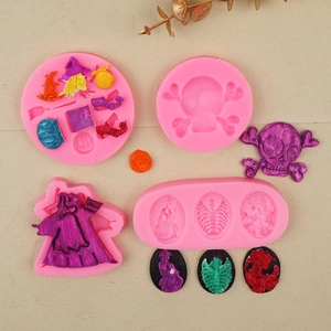 Detail of pink silicone Halloween molds featuring skull, witch hat and pumpkin shapes