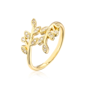 Detail of gold-plated leaf ring showing intricate cubic zirconia settings and polished finish