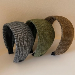 Retro knit wide headband with herringbone pattern in grey green and brown colors