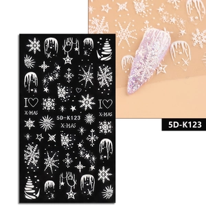 Detailed view of 5D white embossed Christmas nail stickers with snowflakes and stars