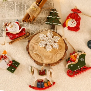 Christmas resin ornament set featuring Santa and Snowman on rustic wood background