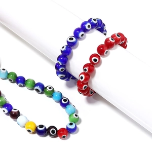 Three assorted colorful evil eye beads bracelets made of glass for DIY jewelry making