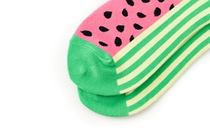 Detail shot of crew socks with pink watermelon pattern and green striped cuffs