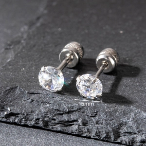Macro view of 5mm cubic zirconia stud earrings with silver-tone four-prong setting
