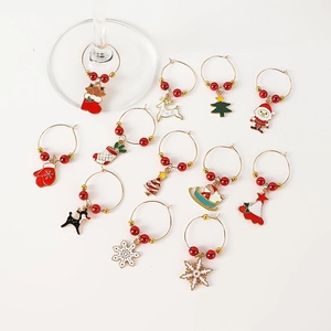 Set of 12 Christmas wine glass charms with festive enamel pendants and metal rings