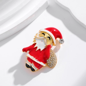 Broche Père Noël festive avec sac cadeau en strass étincelants et émail rouge