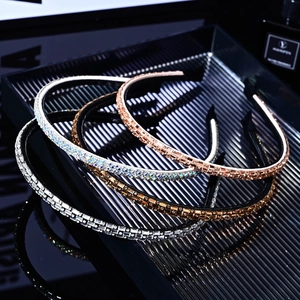 Set of four shimmering thin rhinestone headbands in silver, rainbow, gold, and amber colors