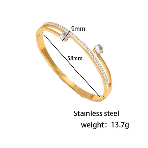 Gold stainless steel cuff bracelet with sparkling cubic zirconia and detailed dimensions