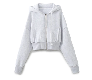 Close-up of light grey cropped zip-up hoodie with drawstring and ribbed cuffs