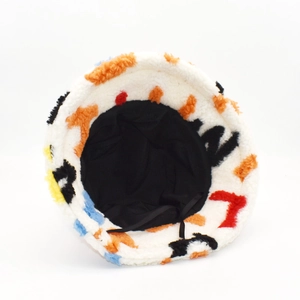 Plush faux lambswool bucket hat with colorful abstract letter print and black inner lining
