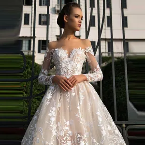 Elegant off-shoulder lace wedding dress with long sleeves and floral embroidery A-line silhouette