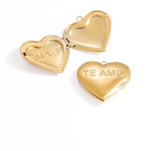Polished gold heart locket pendant with Te Amo engraving shown open and closed
