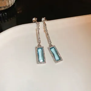 Silver square zircon drop earrings featuring long tassels and blue crystals in a chic design