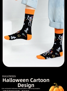 Detail of Halloween crew socks featuring skull and wizard hat patterns on cotton fabric
