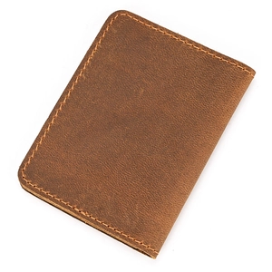 Close-up of brown crazy horse leather card holder showing durable stitching details