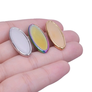 Detailed comparison of oval heart-shaped stainless steel charms in silver, gold, and rainbow
