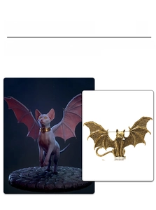 Macro detail of gothic winged sphinx cat brooch with vintage gold finish and bat wings