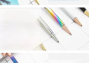 Macro detail of a rose gold pen tip with smooth ink flow and colorful glitter liquid