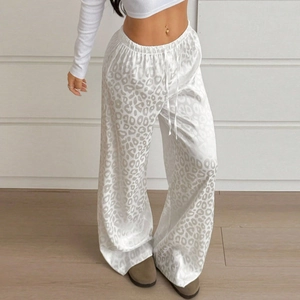Close-up of leopard print jacquard fabric and elastic waistband on wide leg pants
