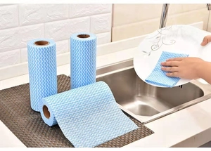 Three rolls of blue and white wave pattern non-woven cleaning cloths for kitchen use