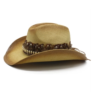 Western straw cowboy hat with brown feathers and golden skull studs for outdoor sun protection