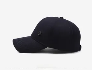 Side view detail of middle-aged men's baseball cap with metal shield logo and stitching