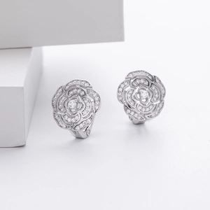 Close-up of S925 sterling silver flower earrings with sparkling cubic zirconia stones
