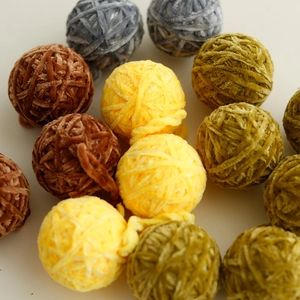 Close-up of handmade 5cm chenille craft balls in natural earthy tones for Christmas DIY