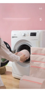 Detailed view of pink fine mesh laundry bags in various sizes for washing machines