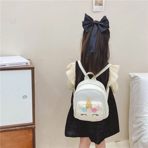 Cute cream unicorn backpack for girls featuring gold horn and colorful floral details