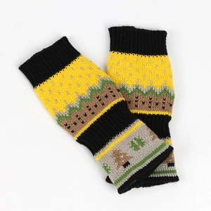 Detailed close-up of colorful knitted Christmas hand warmers with ethnic jacquard patterns