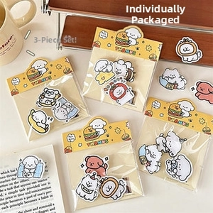 Detailed view of cute cartoon dog sticker packs with yellow header cards and cozy stationery