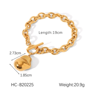 Detailed view of golden stainless steel bracelet with baroque pendant and dimensions
