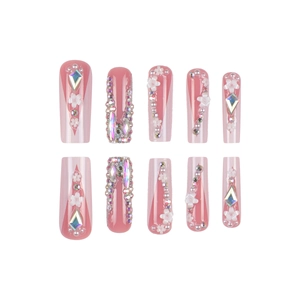 White French press-on nails with 3D flowers, pearls, and rhinestones in long coffin shape