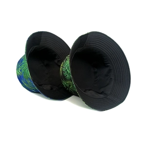 Double-sided sun bucket hat with tropical palm leaf print in green and navy blue colors