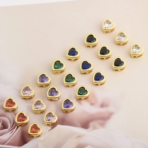 Detailed view of colorful heart-shaped cubic zirconia charms for DIY jewelry making