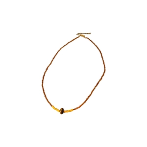 Vintage tiger eye stone horse pendant necklace with brown beads on a white background