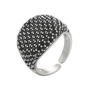 Macro detail of pave set black round gemstones on an adjustable silver metal wide ring band