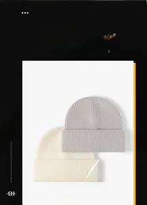 Detailed rib-knit texture of thick grey and off-white winter beanies with double cuffs