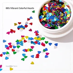 Detailed macro view of 3mm colorful heart-shaped laser sequins for nail art decoration