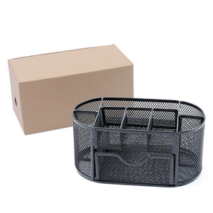 Detail view of black mesh metal desk organizer with multi-compartments and bottom drawer
