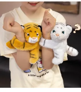 Plush animal wrist bands with cute tiger cubs worn on arm in cozy home setting